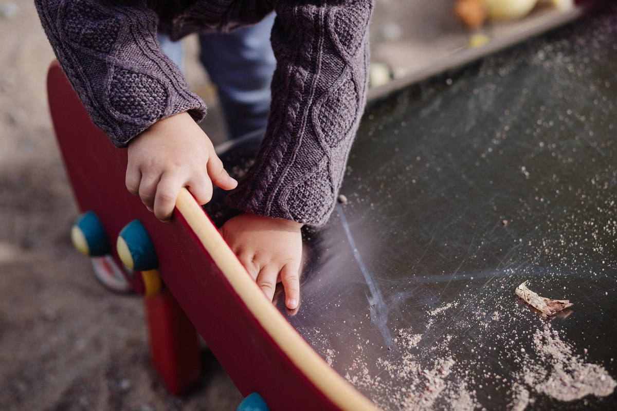 A young child playing outdoors